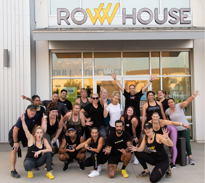 Group posing in front of the Row House building