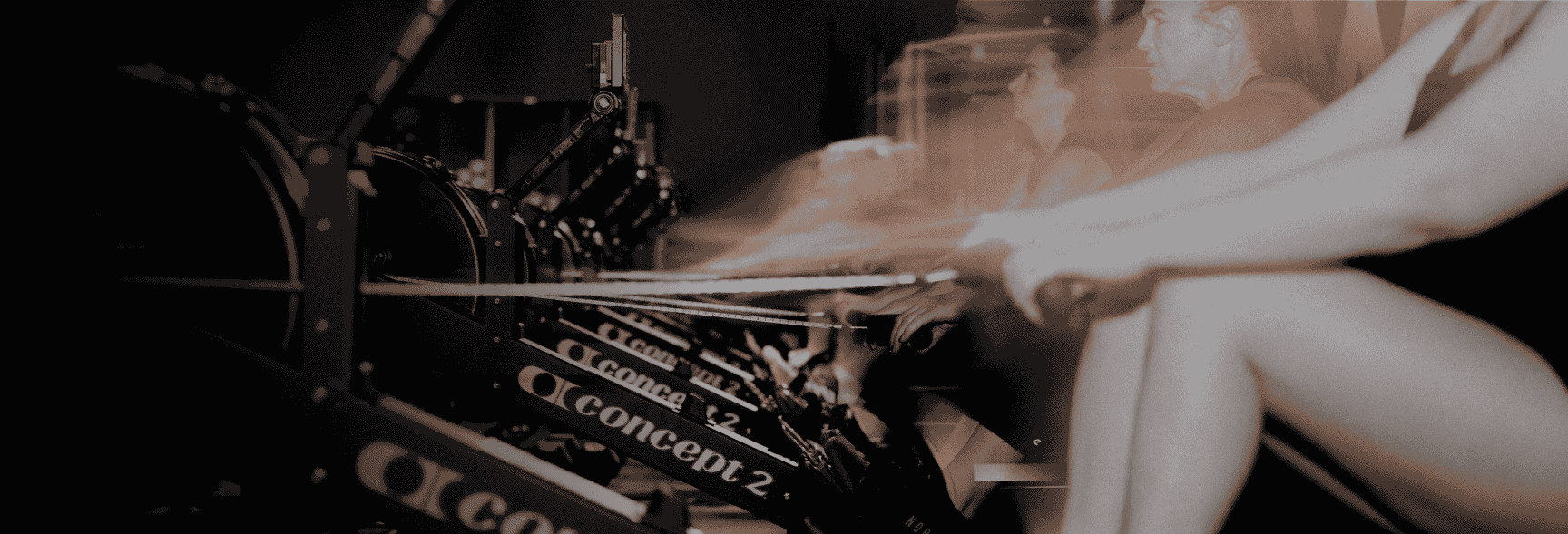 Row House Members Rowing in Class