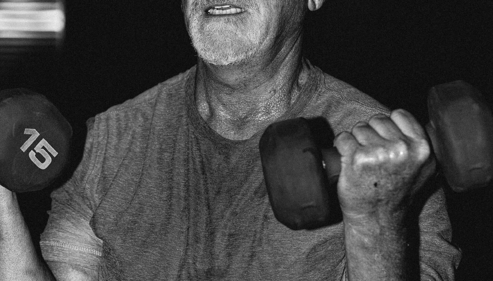 member lifting weights in class