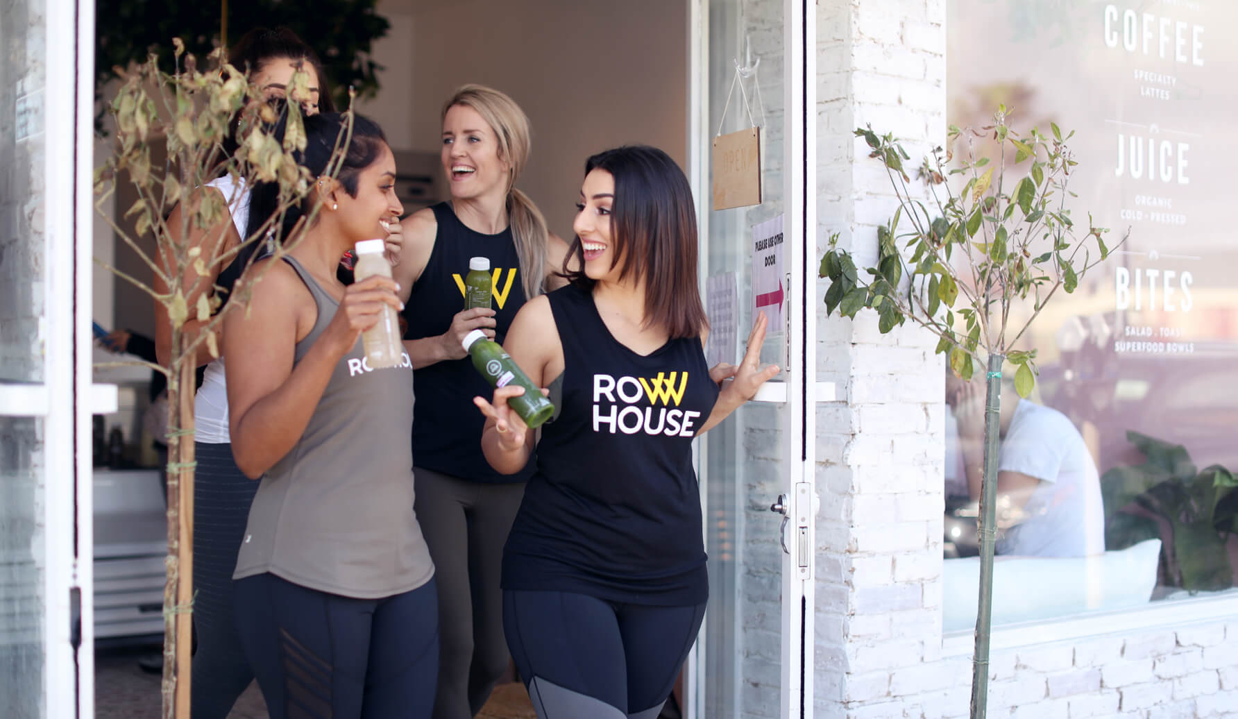 Three people smiling at Row House